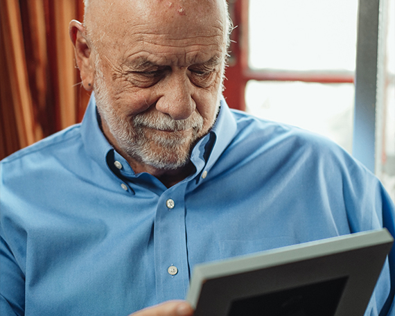 man looking at photos