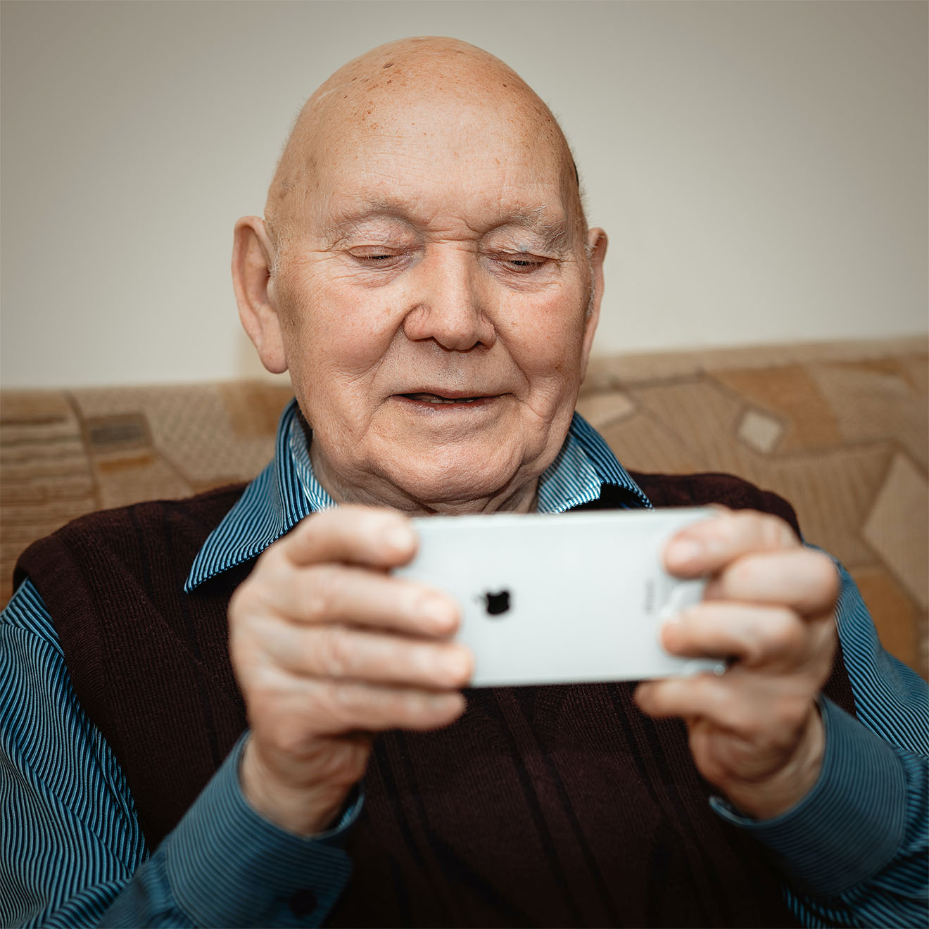 resident smiling on phone
